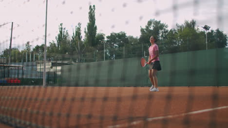 slow-motion-female-tennis-player-hitting-the-ball-during-a-game